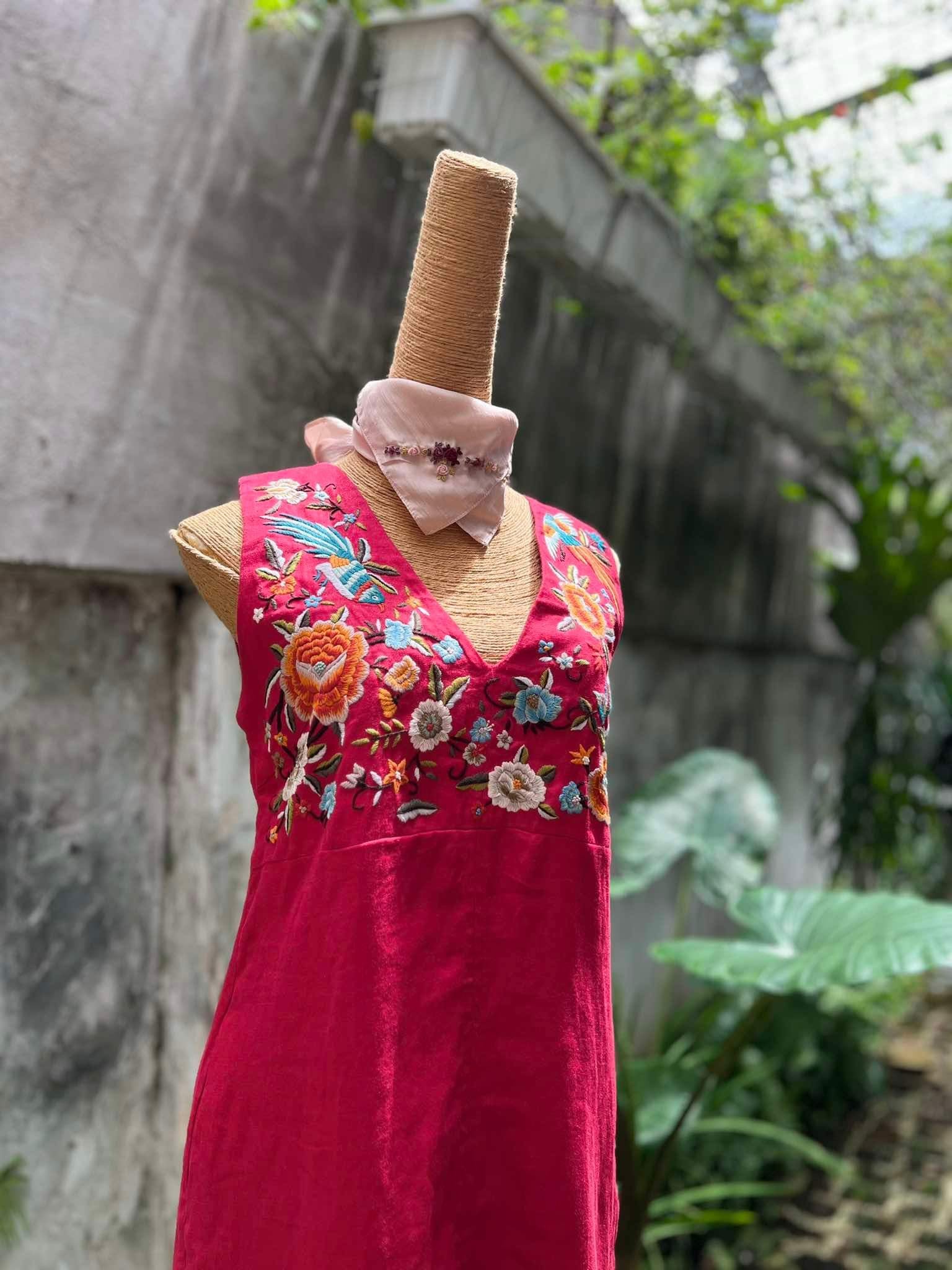 "Phoenix and Flowers" embroidered V-neck red linen dress by Huulala, featuring modern floral patterns, showcasing Vietnamese artisan craftsmanship.