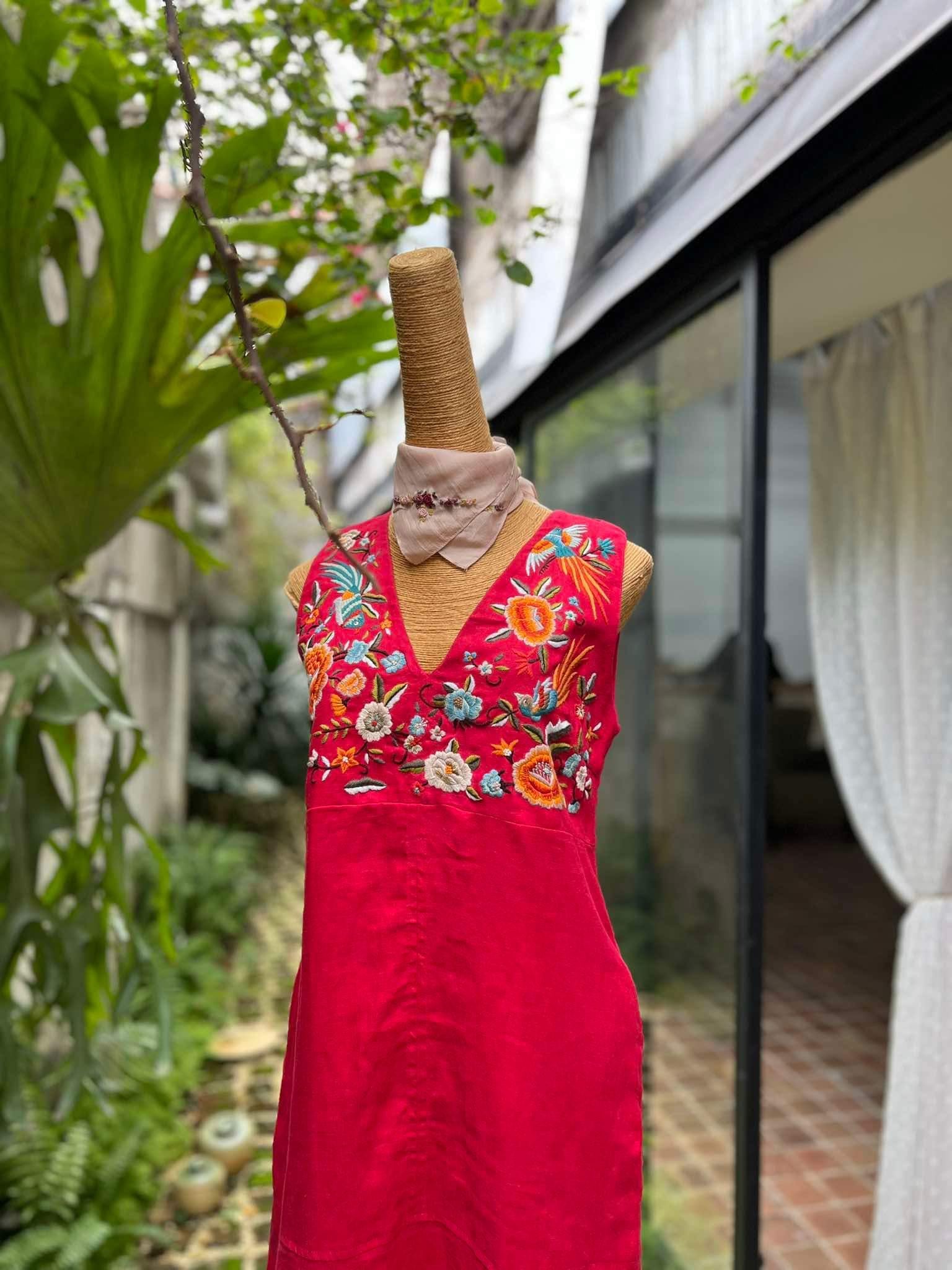 "Phoenix and Flowers" embroidered V-neck red linen dress by Huulala, featuring modern floral patterns with Vietnamese artisan craftsmanship.