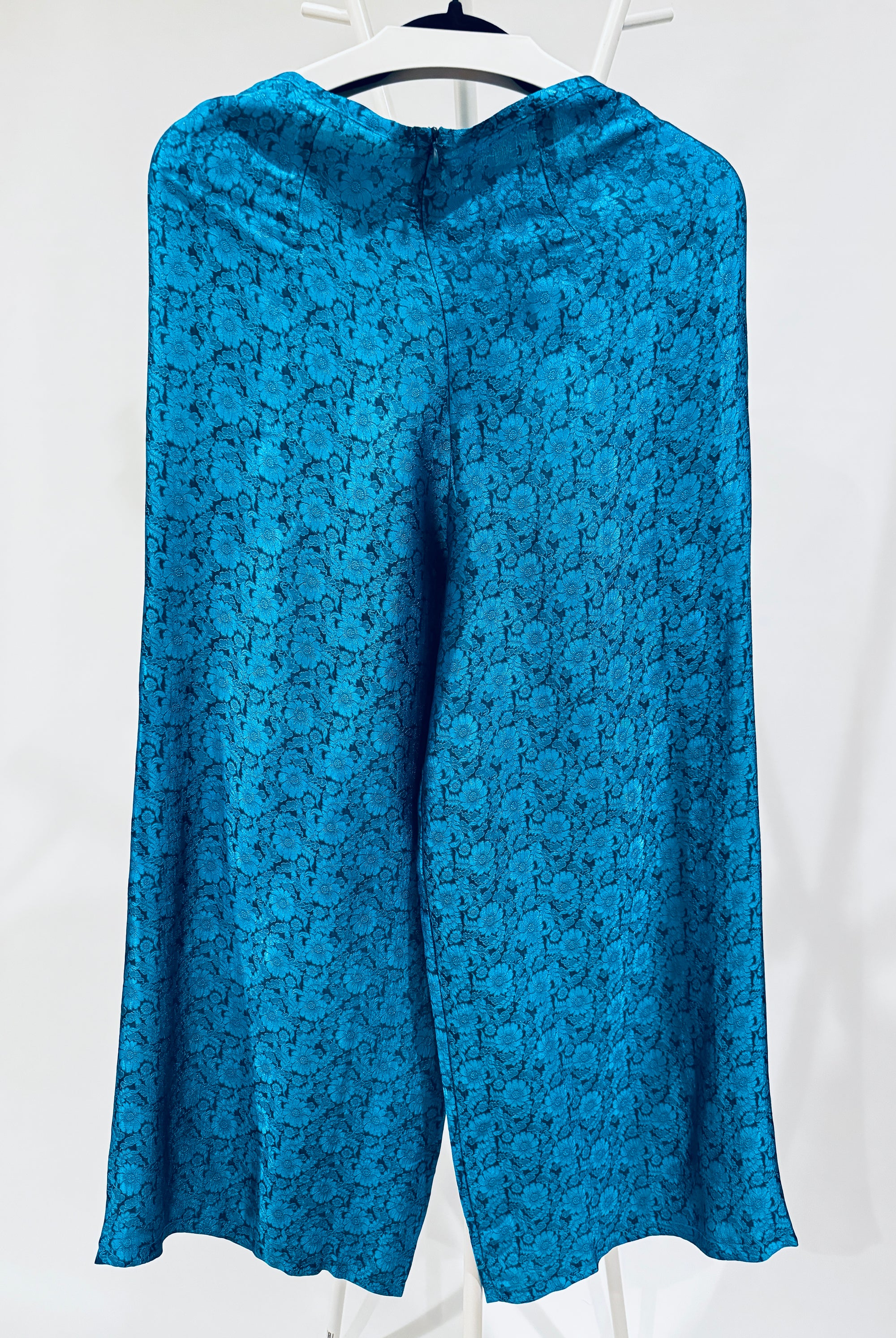 "Traditional Vietnamese Ao Dai pants in blue wormsilk with chrysanthemum jacquard pattern."