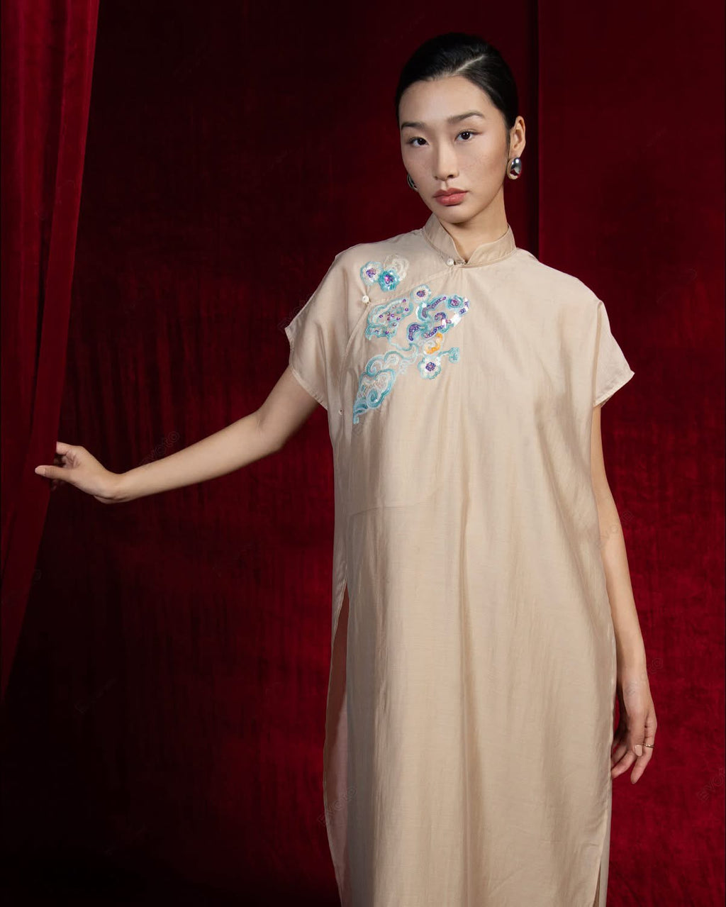 "Van Sa Set - Beige silk Ao dai tunic with traditional Vietnamese embroidery by Hy Phuong."