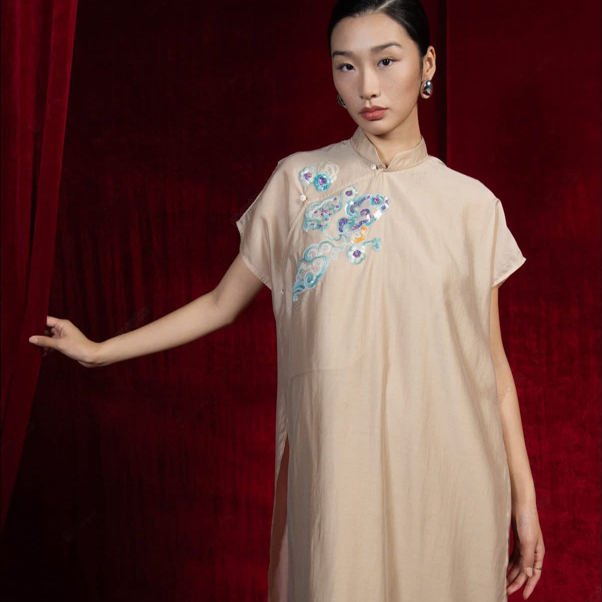 "Van Sa Set - Beige silk Ao dai tunic with traditional Vietnamese embroidery by Hy Phuong."