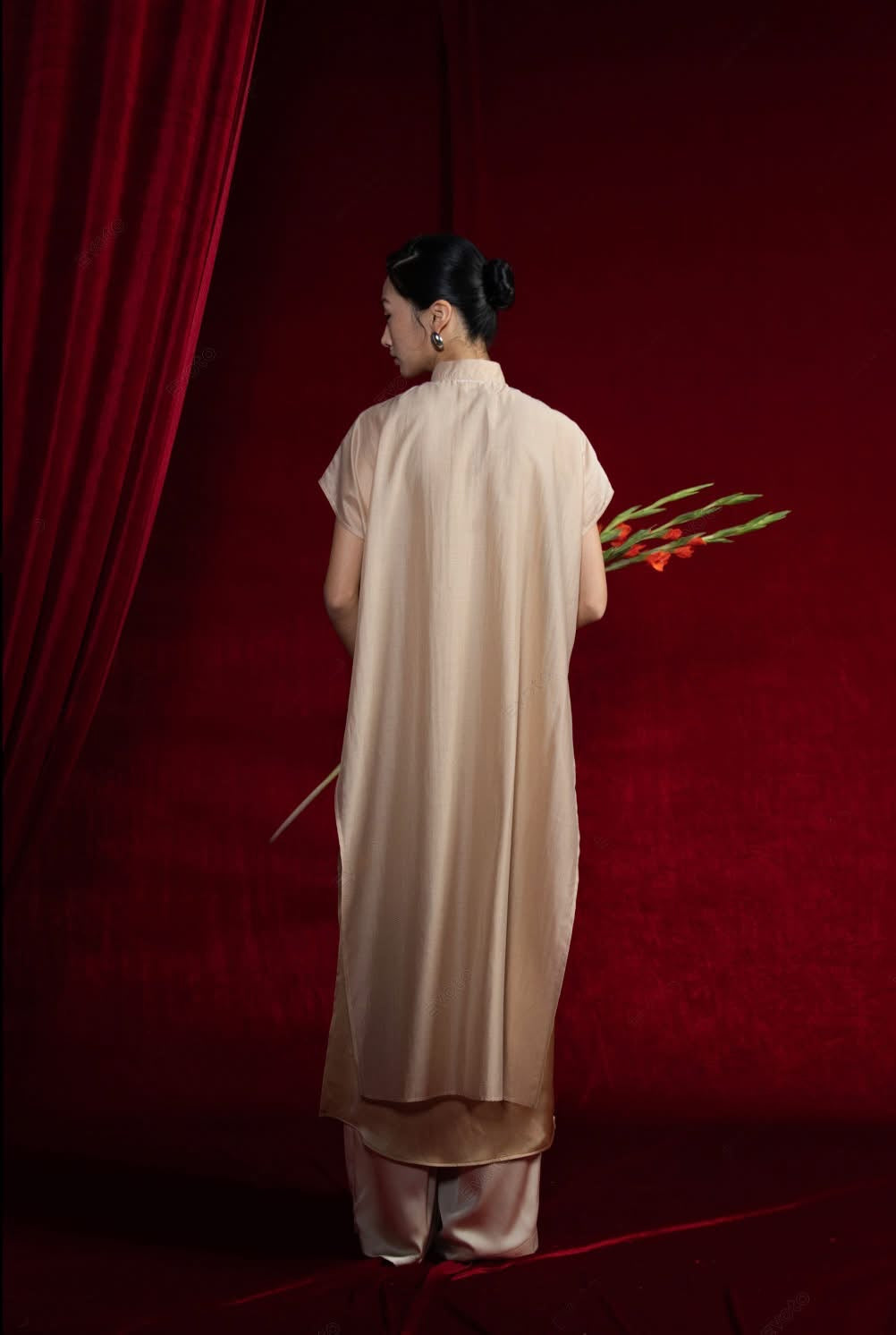 "Van Sa Set - Beige Ao dai, traditional Vietnamese silk tunic with modern design by Hy Phuong."