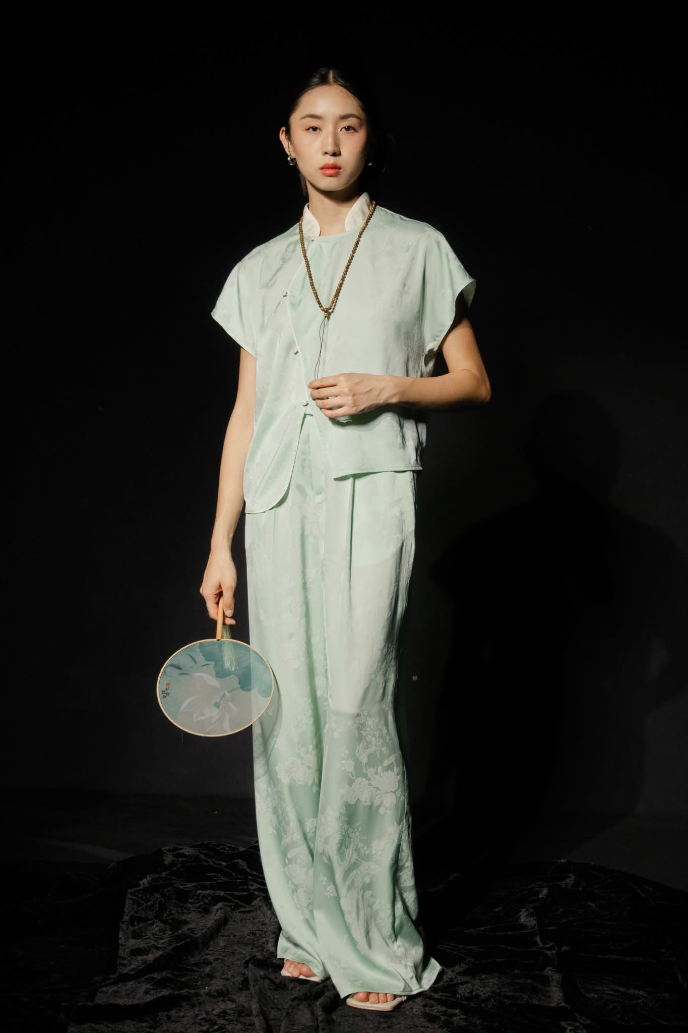 "Nghinh Xuân" Vietnamese top in mint green jacquard with modern patterns by Hy Phuong.