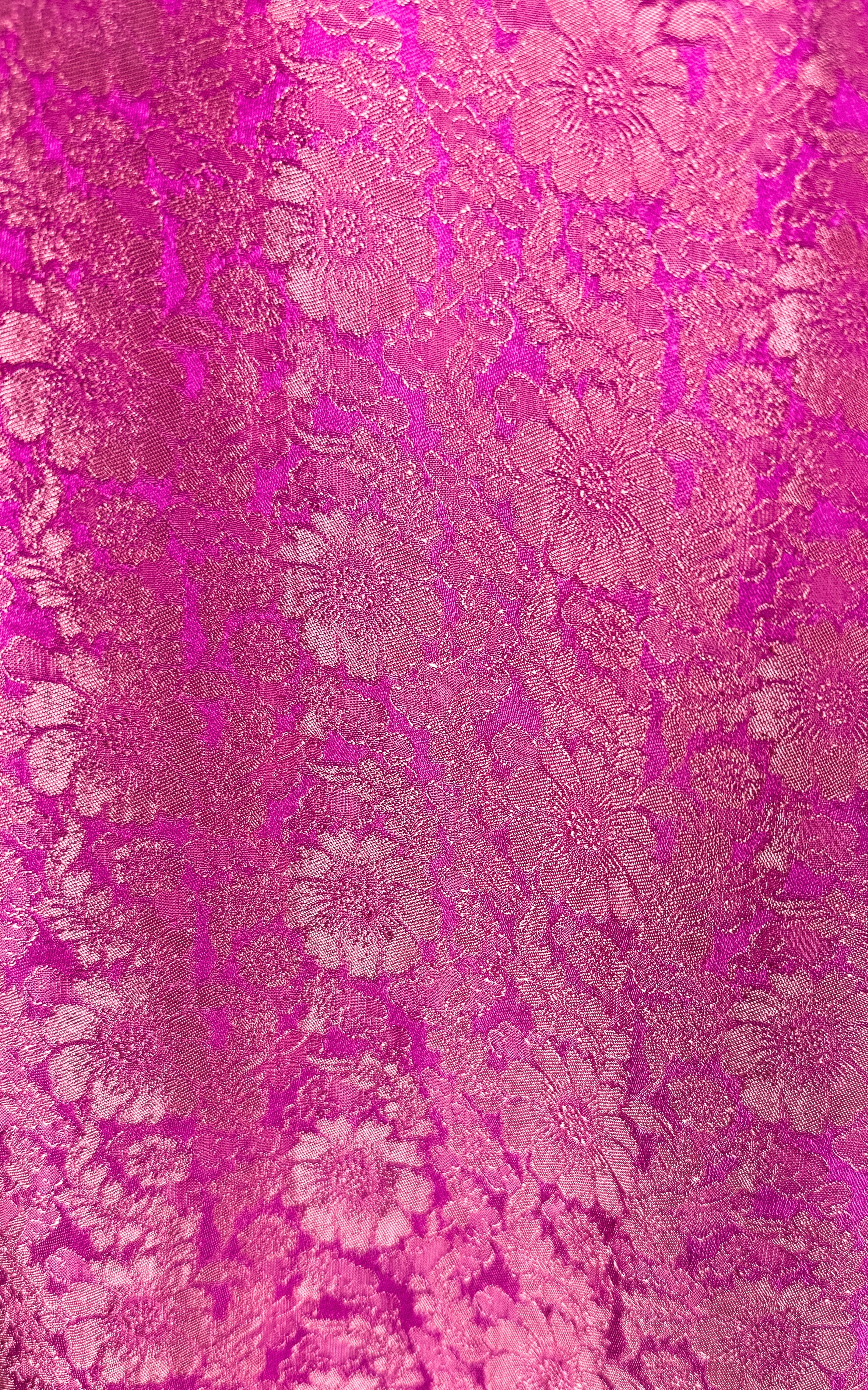 "Traditional Vietnamese Ao Dai pants in pink silk jacquard with chrysanthemum pattern."