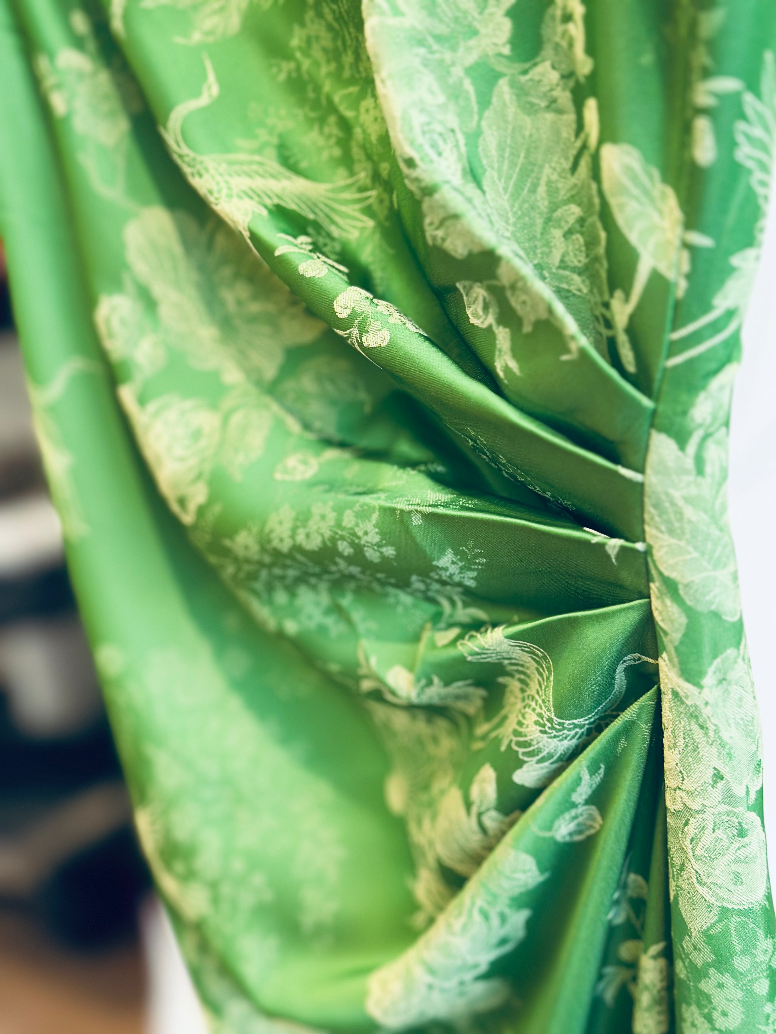 "Sleeveless Cheongsam top in green silk jacquard with modern pattern by Hy Phuong"