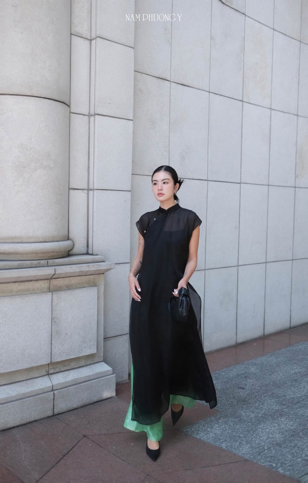 Black sleeveless silk áo dài with floral jacquard detail and green pants - Nam Phuong Y Bich Lien set
