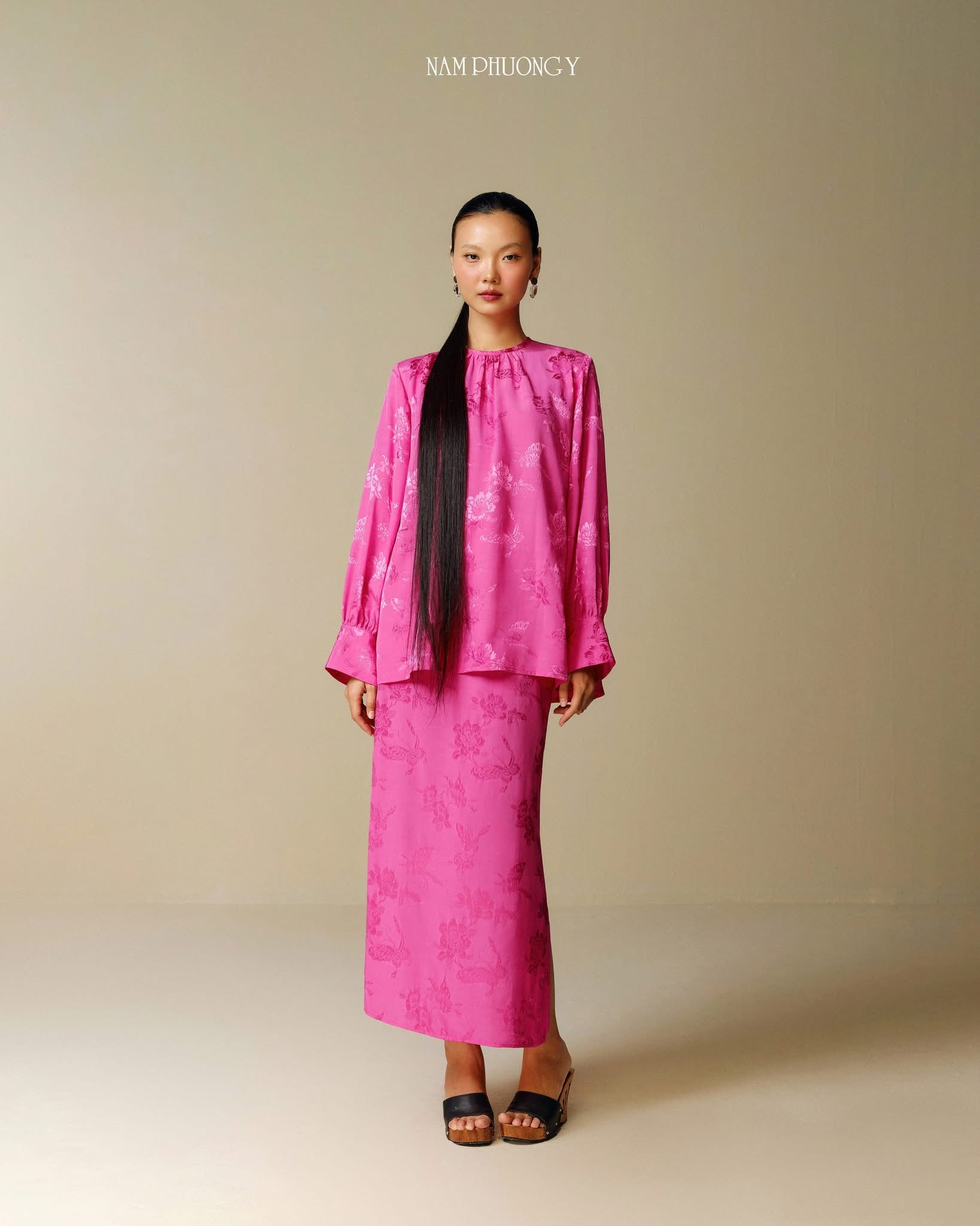 "Traditional Vietnamese dress 'Dong' in blooming fuchsia jacquard silk by Nam Phuong Y"