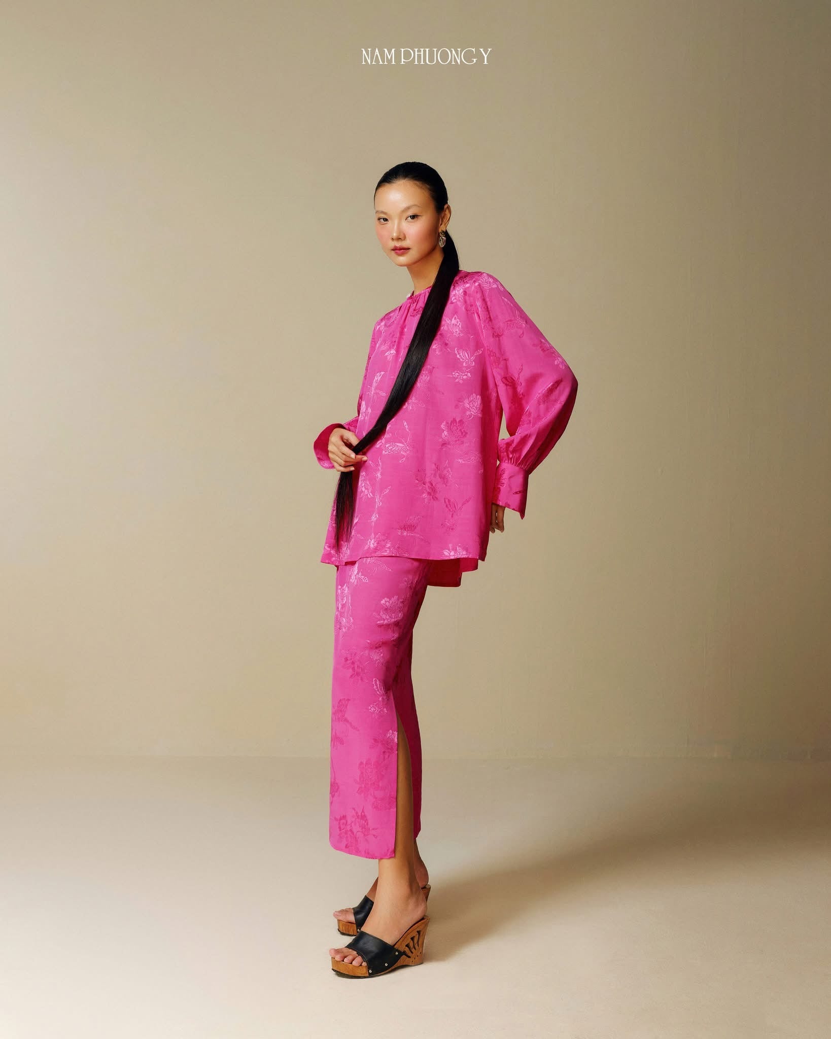 "Traditional Vietnamese dress 'Dong' in blooming fuchsia jacquard silk by Nam Phuong Y"