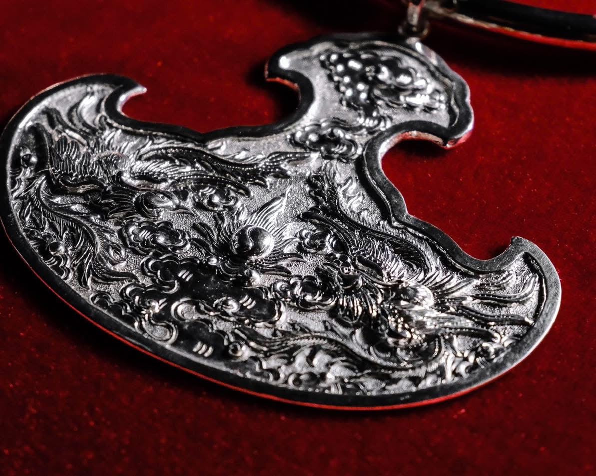Song Phuong Bội – Twin Phoenix Cloud Pendant in Fine Silver - detailed view highlighting fabric texture and quality by HI de Maison at L'Orient Haus