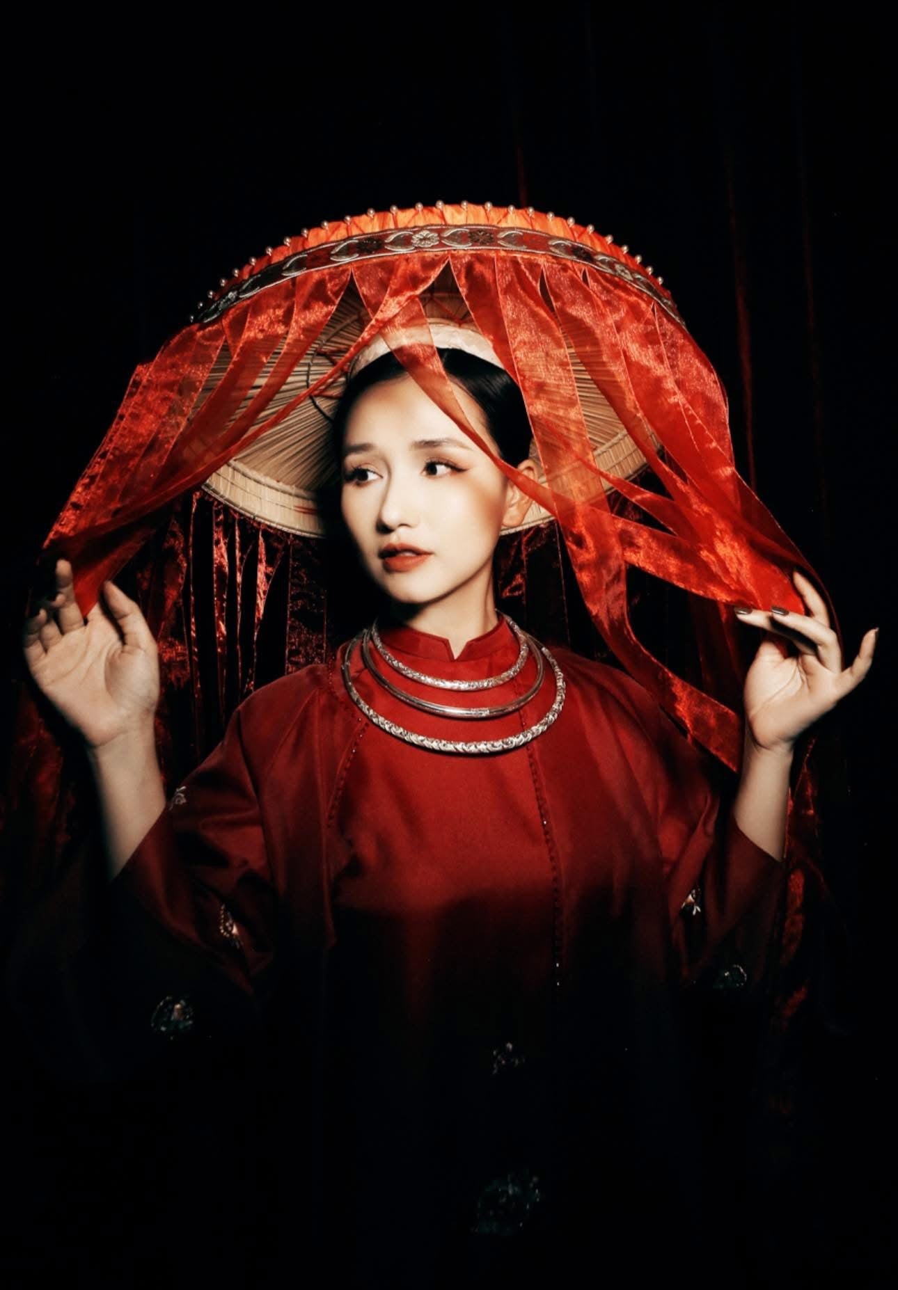 "Vang Long Minh Torque Necklace in fine-silver dragon pattern, red artisan design, Vietnamese heritage"