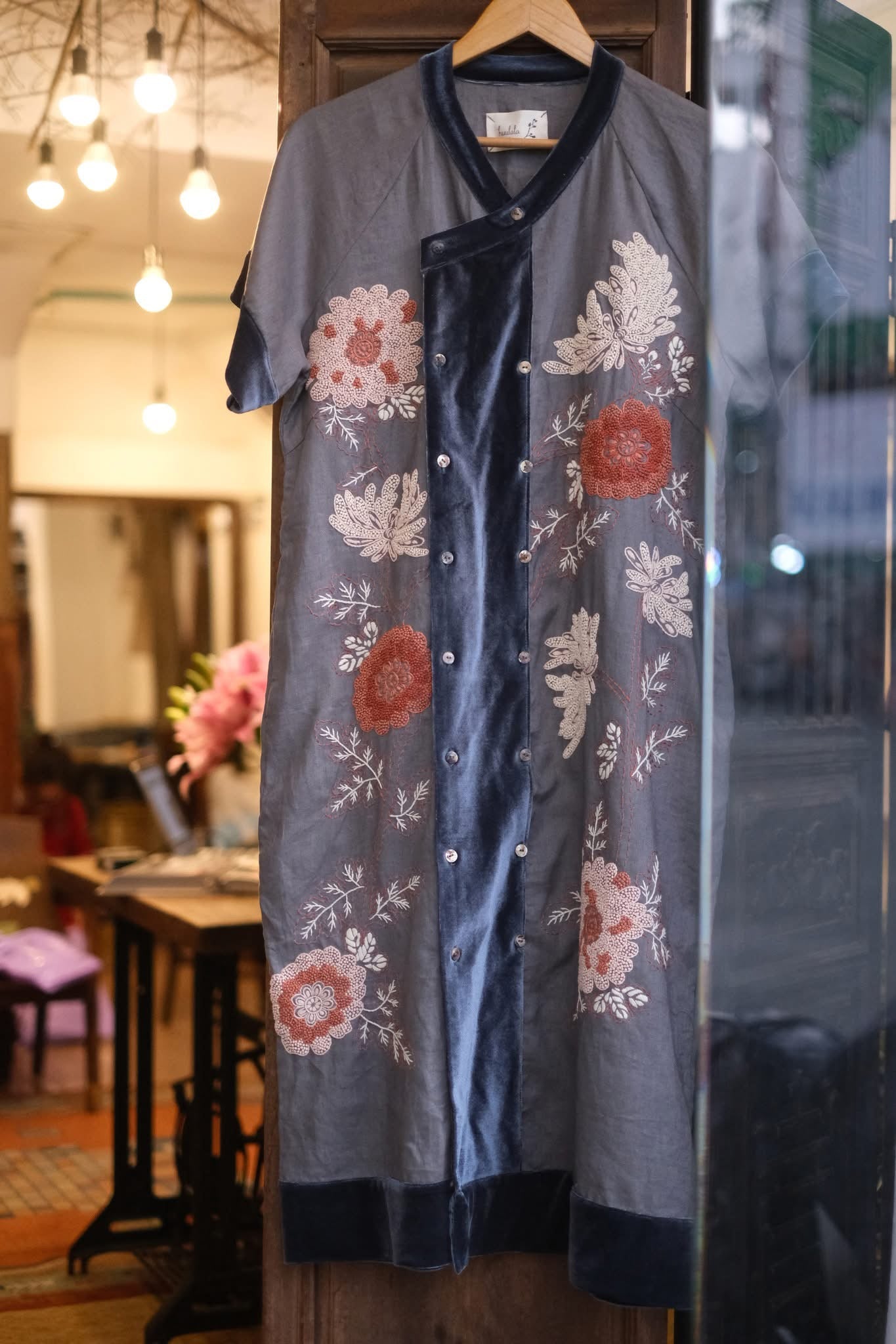 "Uni mid-length kimono with velvet trim, featuring red and white floral embroidery on silk, cotton, and linen blend, by Huulala, inspired by traditional Vietnamese design."