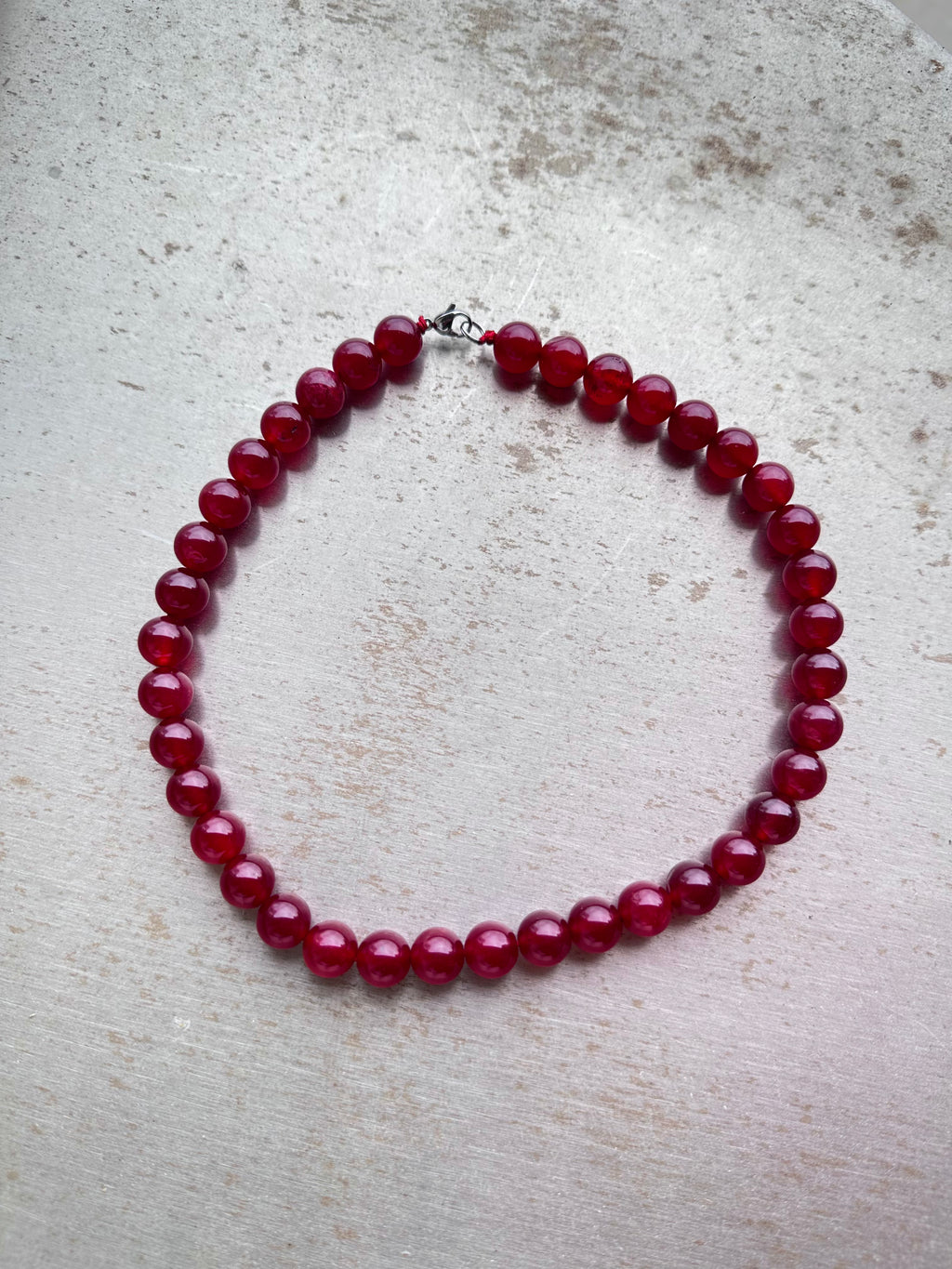 "Verdant Echo" Marble Necklace in Ruby Shades (Large) - close-up detail | Vietnamese Luxury Fashion