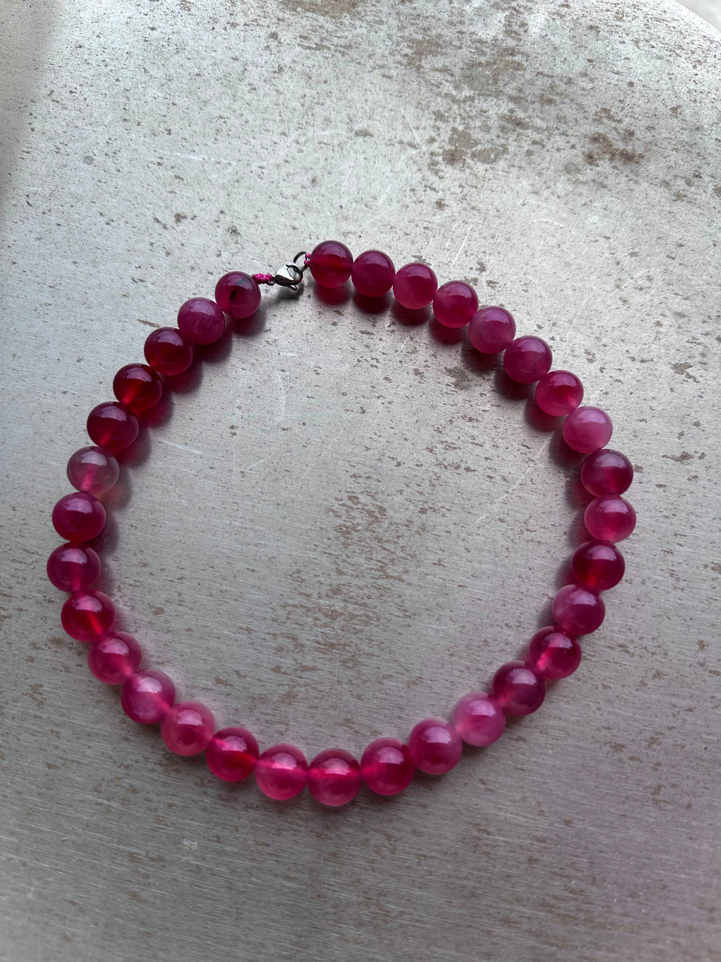 "Verdant Echo" Marble Necklace in Ruby Shades (Large) - lifestyle shot | Vietnamese Luxury Fashion