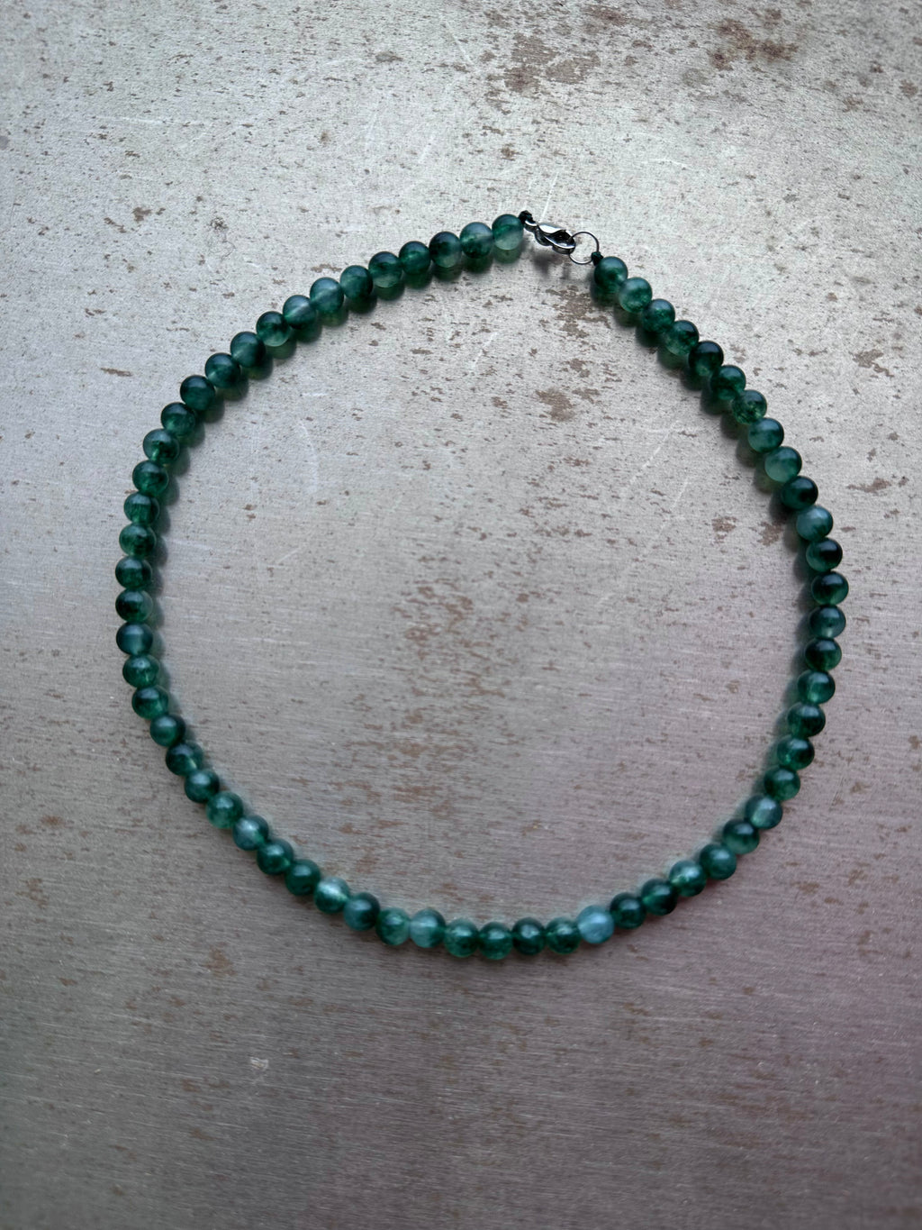 "Verdant Echo" Marble Necklace in Fresh Jade - lifestyle shot | Vietnamese Luxury Fashion