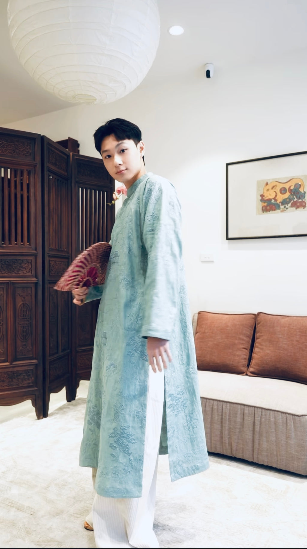 Vietnamese Ao Dai - TAM PHƯƠNG – Men’s Hand-Embroidered Linen Áo Dài - side profile in silk in light blue by Maison LONG