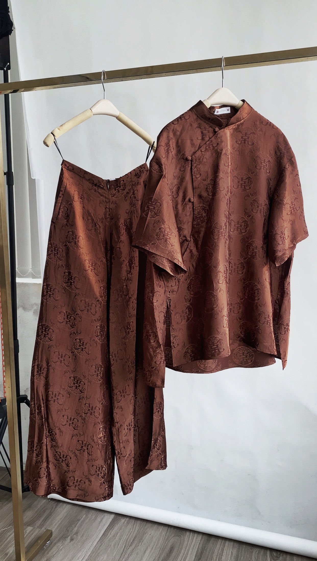 Vietnamese Ao Dai - Ninh Van Set - Mandarin-neck Wormsilk in Earth Brown - flat lay display in brocade in brown by Hy Phuong