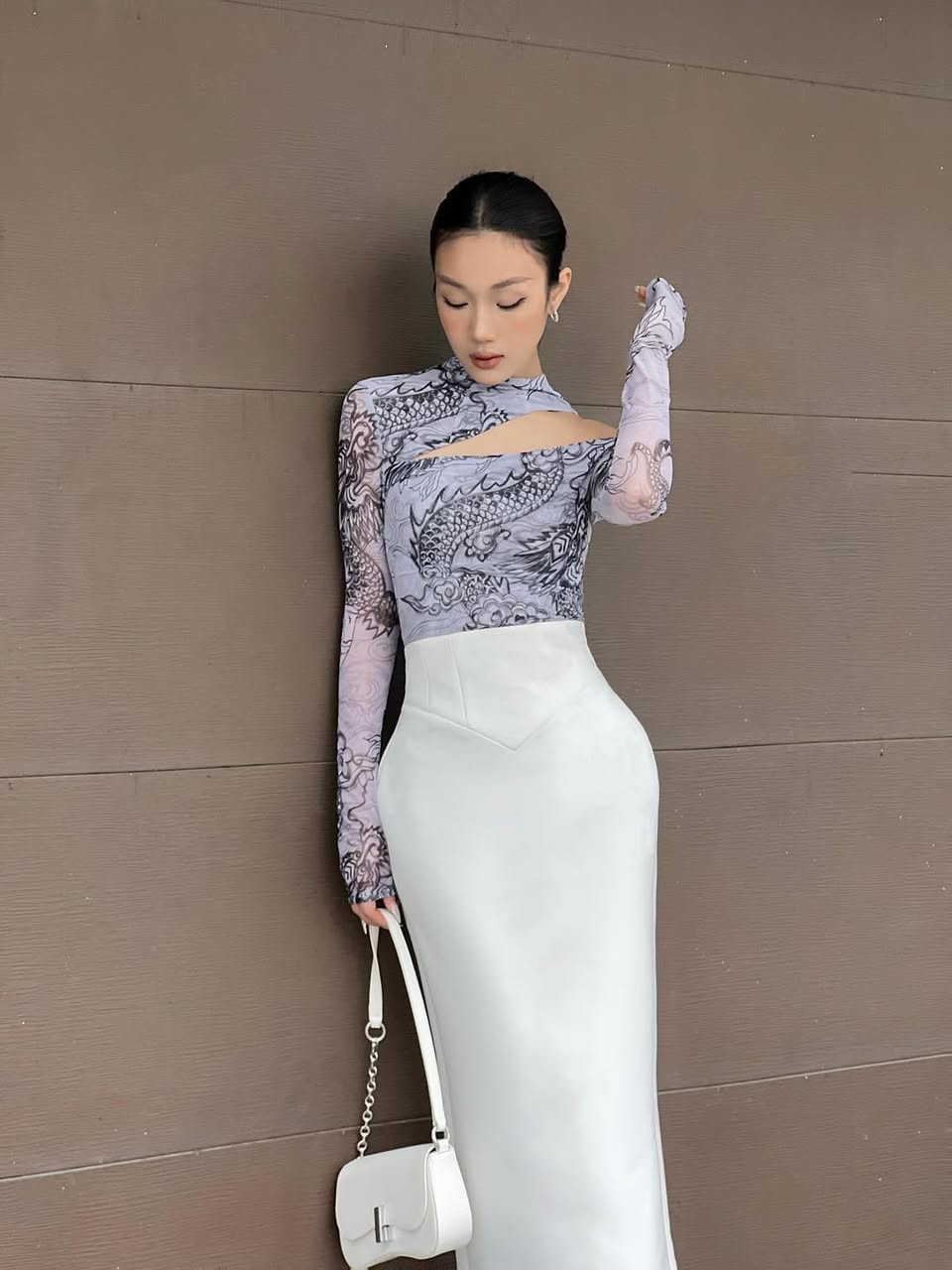 "Jia Chen Cut-out Tulle Top in Black by Keira Tong, featuring traditional dragon pattern, modern design."