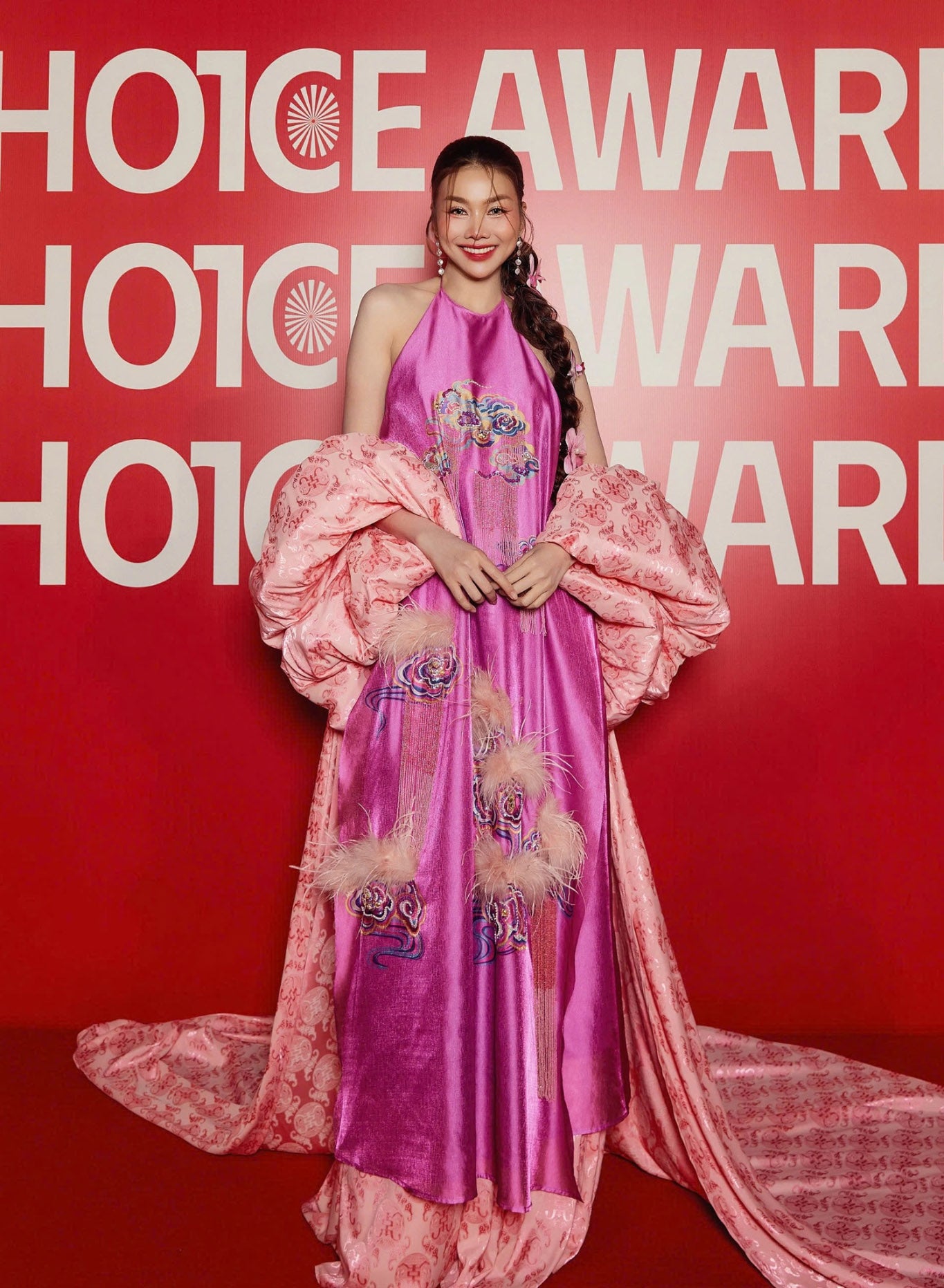 "Uyen Van luxury pink velvet Ao Dai halter dress by Lalin, traditional Vietnamese design with embellishments"