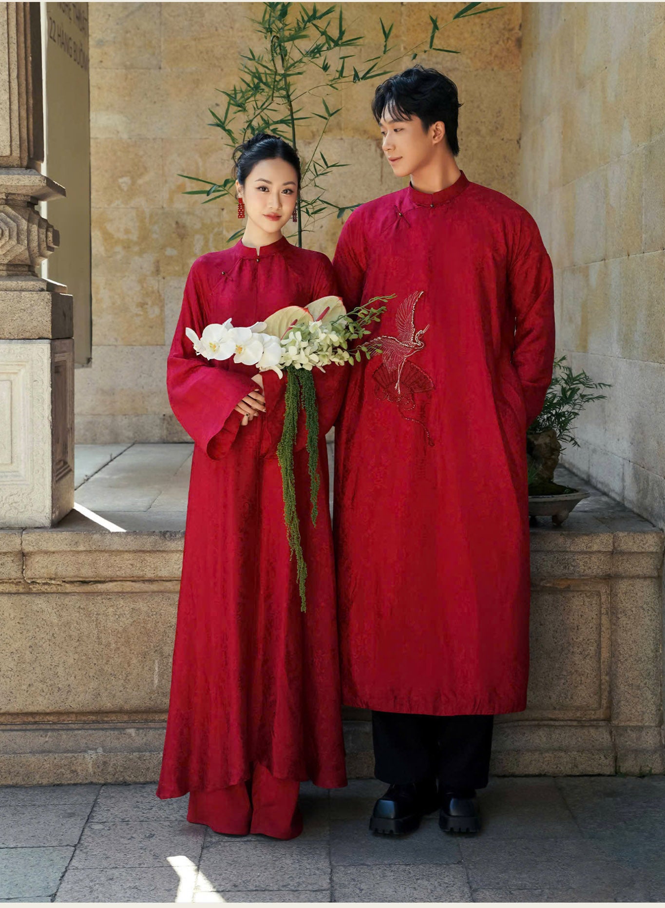 "Hy Loan Ao Dai set in crimson silk, traditional Vietnamese dress by Lalin, featuring artisan woven patterns."