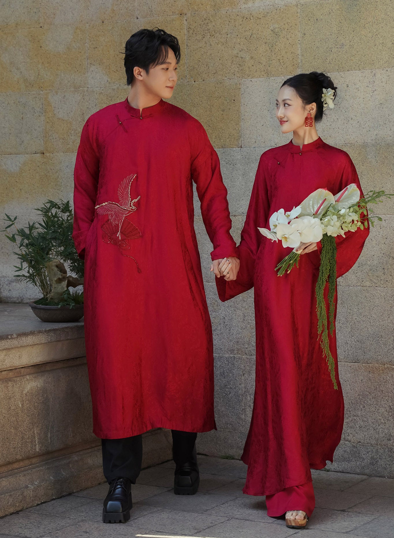 "Hy Loan Ao Dai set in crimson silk, traditional Vietnamese dress by Lalin, cultural heritage attire."