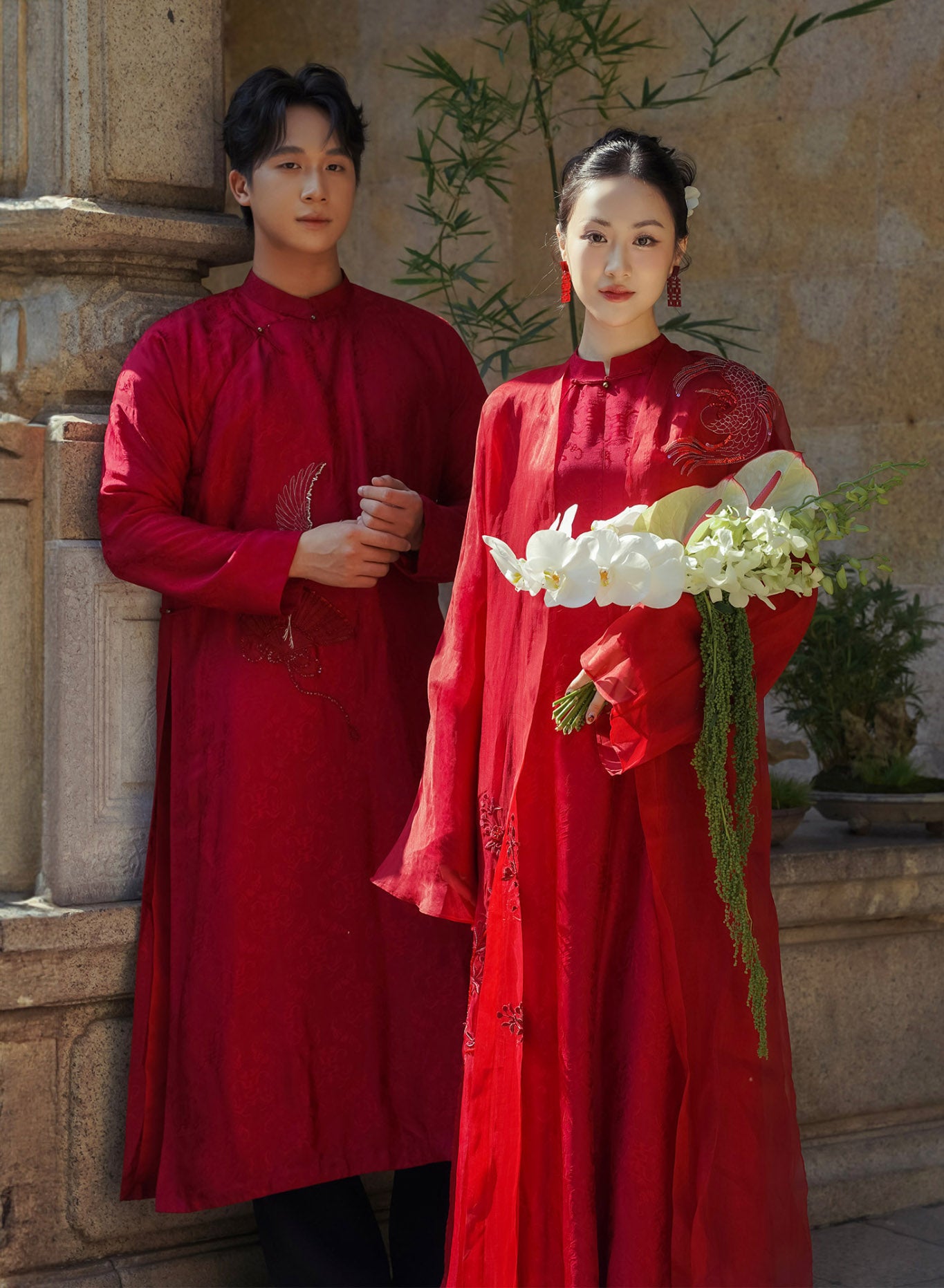 "Hy Loan Ao Dai set in crimson silk, traditional Vietnamese dress by Lalin, cultural heritage attire"