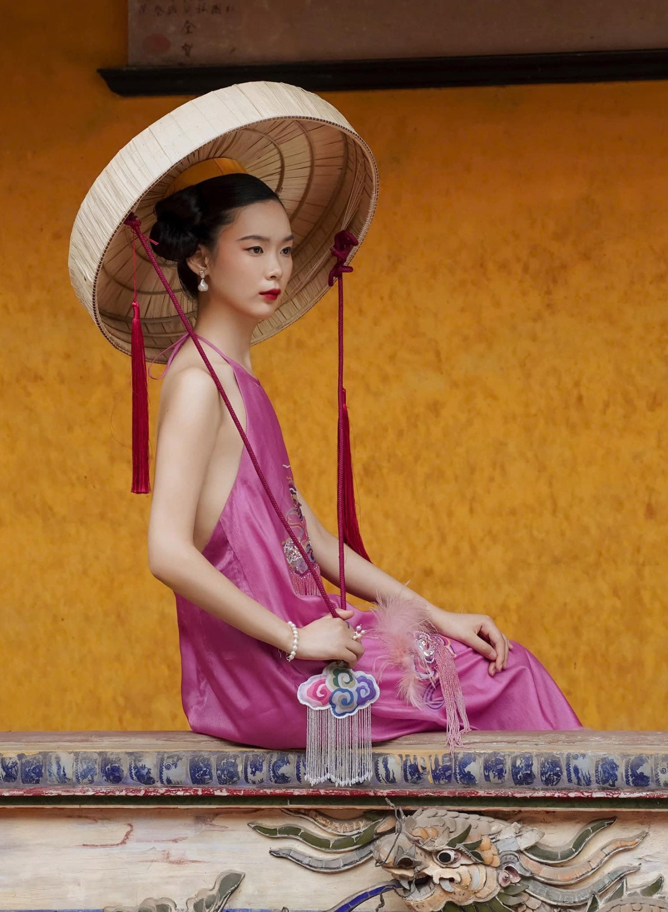 "Uyen Van luxury pink velvet Ao Dai halter dress by Lalin, traditional Vietnamese attire."