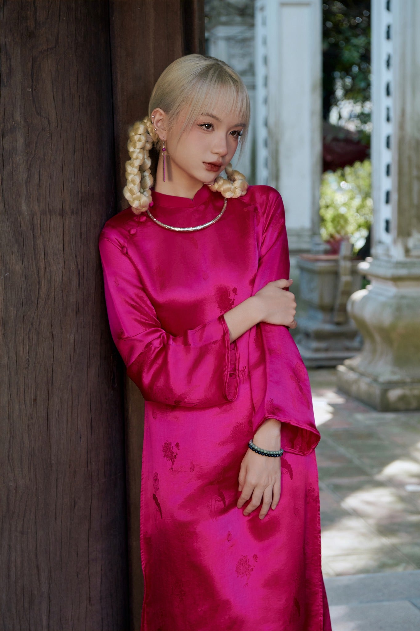 "Magenta silk 'Lien Hoa' Ao Dai set by Moc, traditional Vietnamese dress with modern pattern."