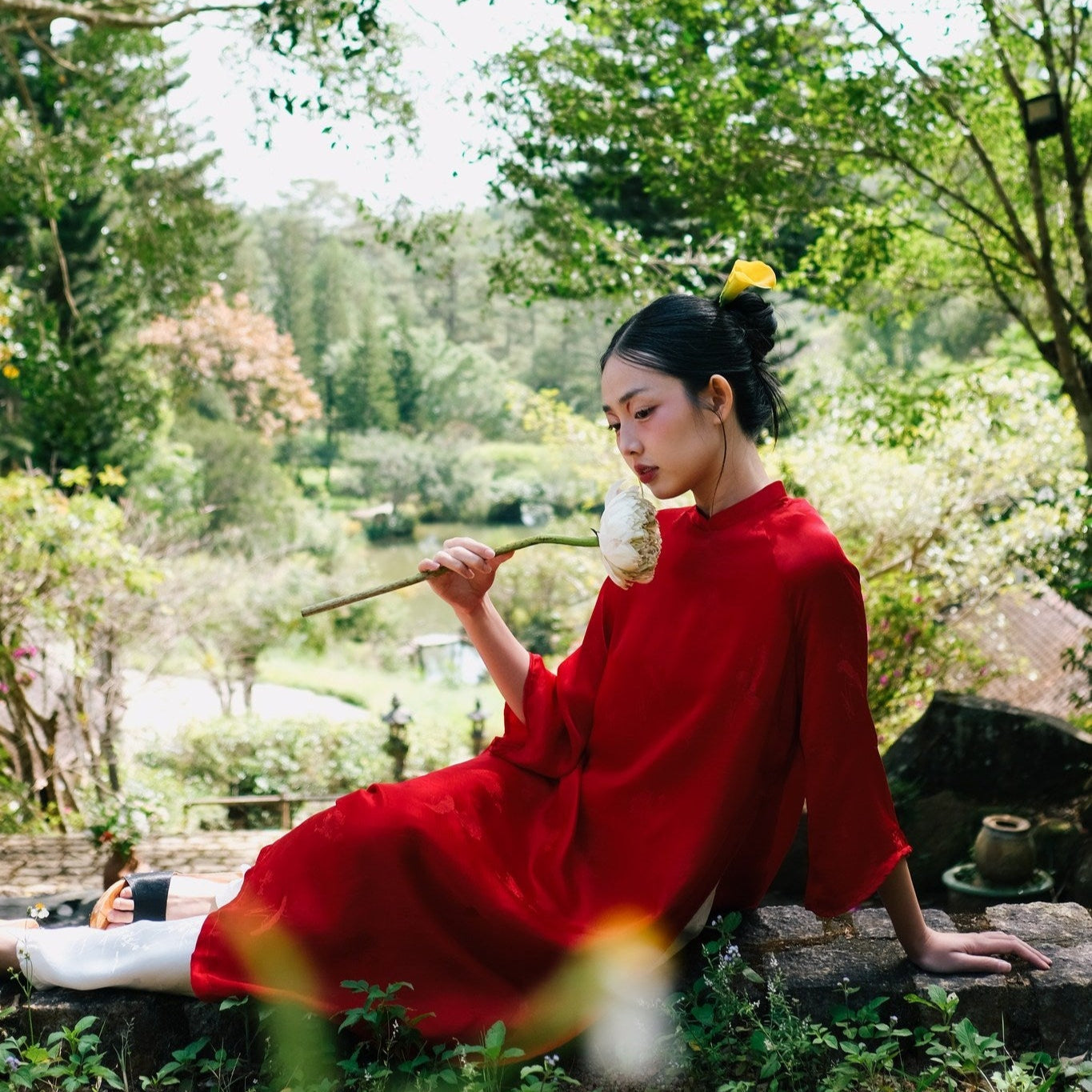 "Red silkworm silk 'Lien Hoa' Ao Dai set by Moc, traditional Vietnamese dress in modern artisan design."