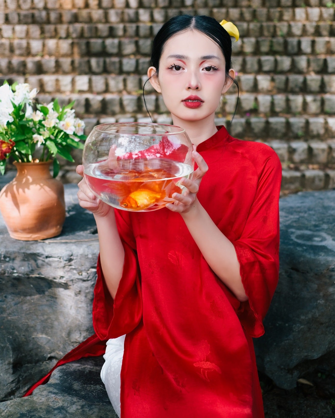 "Red silk 'Lien Hoa' Ao Dai set by Moc, traditional Vietnamese dress with modern artisan design."