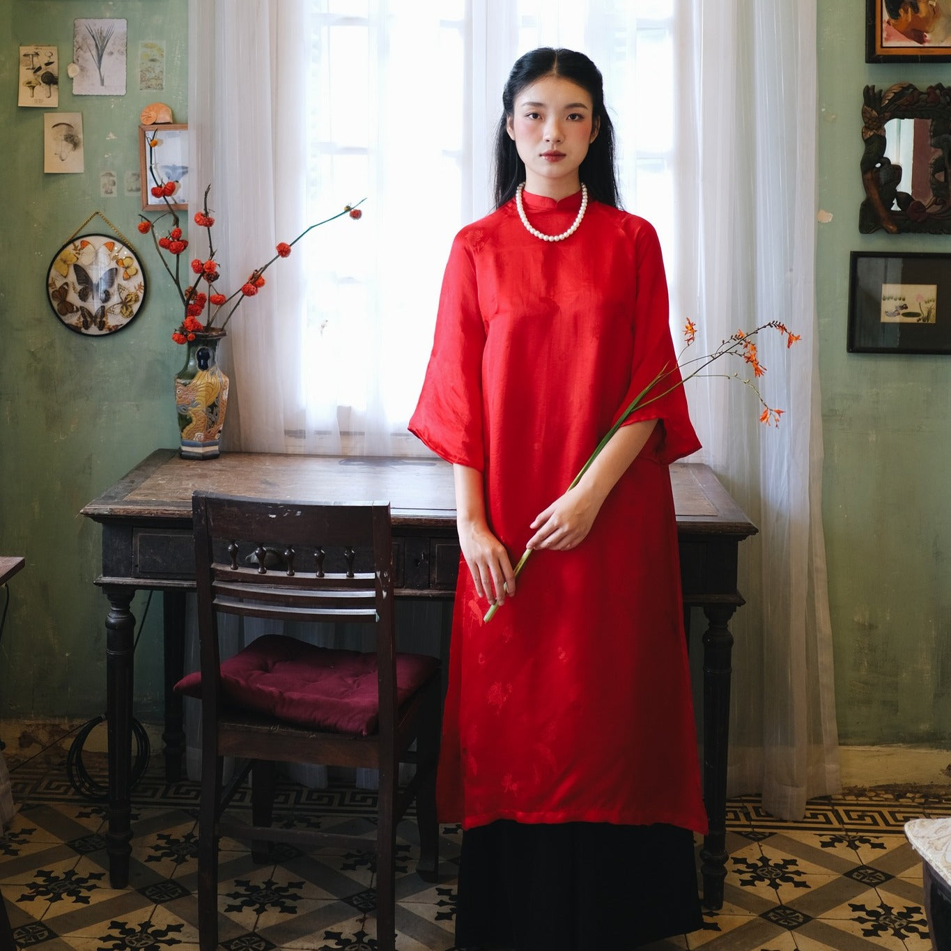 "Red silk Lien Hoa Ao Dai set by Moc, traditional Vietnamese dress with modern design."