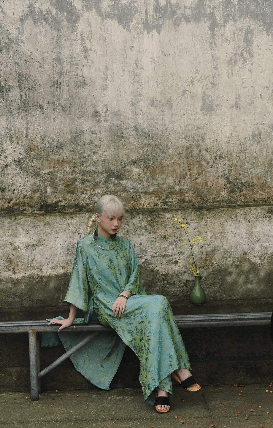 "Loc Tho Ao Dai set in jade wormsilk, traditional Vietnamese dress by Moc, artisan jacquard pattern."