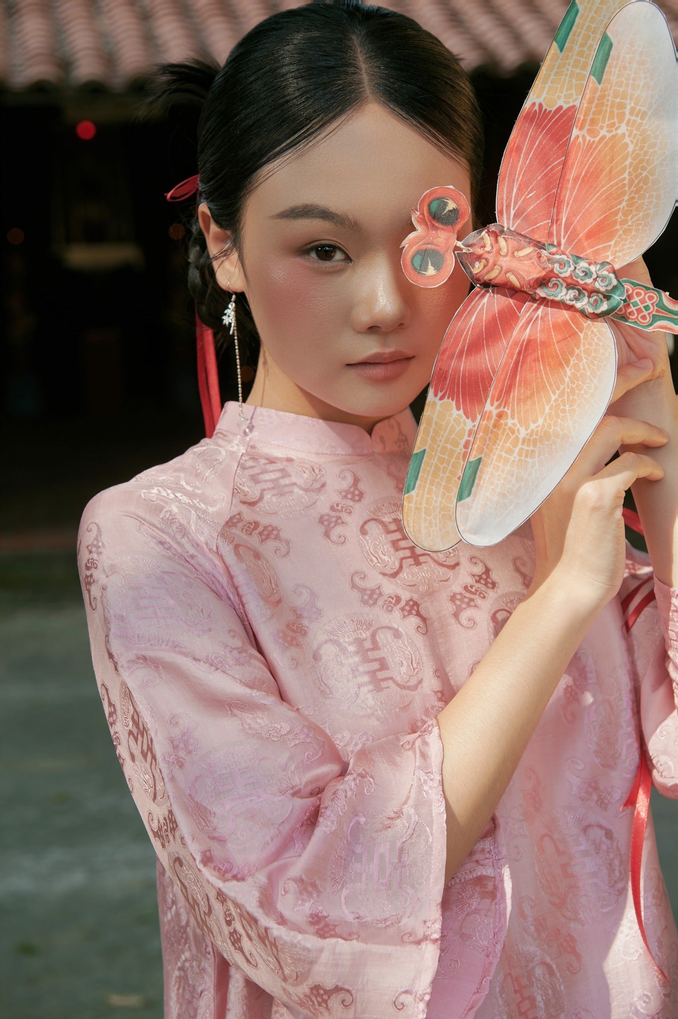 "Loc Tho Ao Dai set in light pink silk with traditional Vietnamese jacquard pattern by Moc"