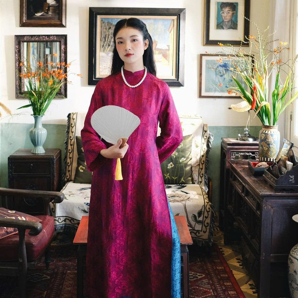 "Loc Tho Ao Dai set in dark magenta wormsilk, traditional Vietnamese dress with artisan jacquard pattern."