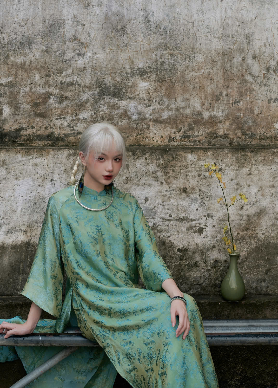 "Loc Tho Ao Dai set in jade wormsilk, traditional Vietnamese dress with modern jacquard pattern."