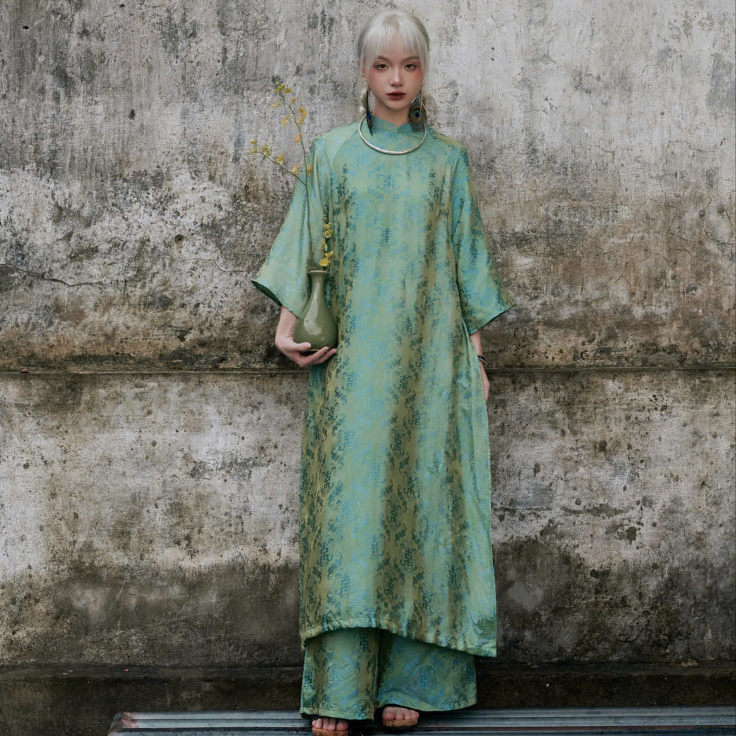 "Loc Tho Ao Dai set in jade silk, traditional Vietnamese dress with modern jacquard pattern."