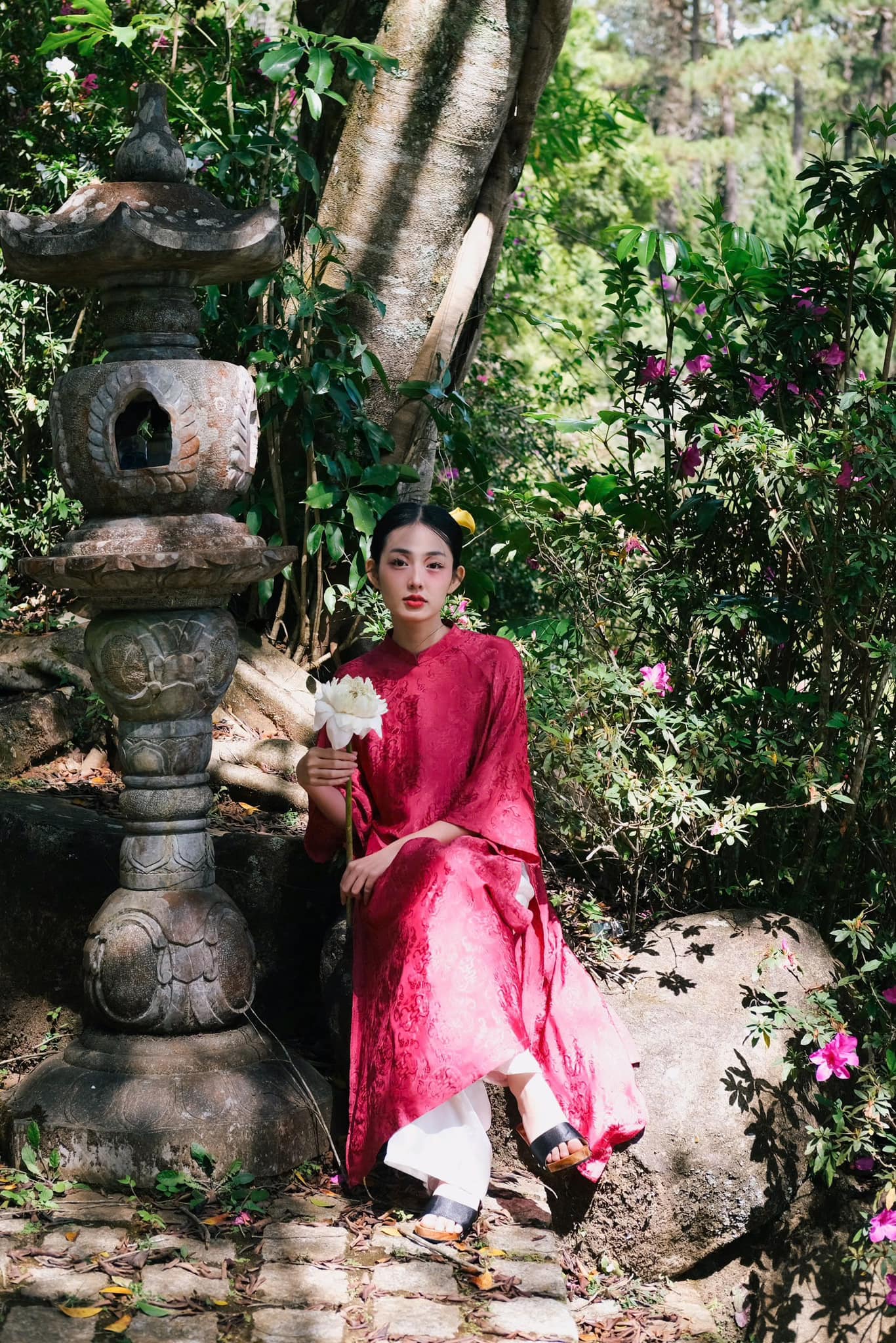 "Loc Tho Ao Dai set in dark pink wormsilk, traditional Vietnamese dress with artisan jacquard pattern."