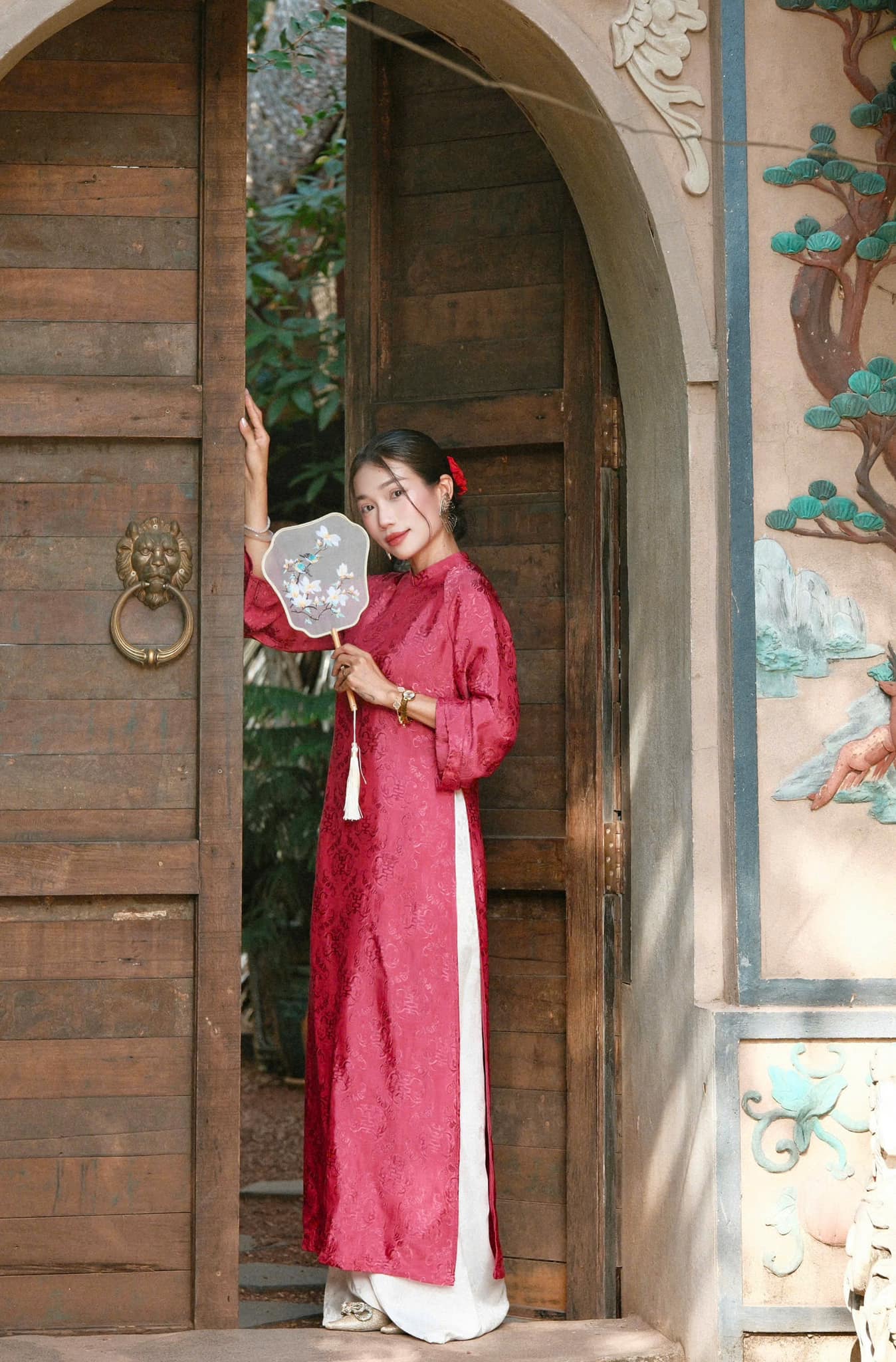 "Loc Tho Ao Dai set in dark pink wormsilk, traditional Vietnamese dress by Moc, featuring artisan jacquard pattern."