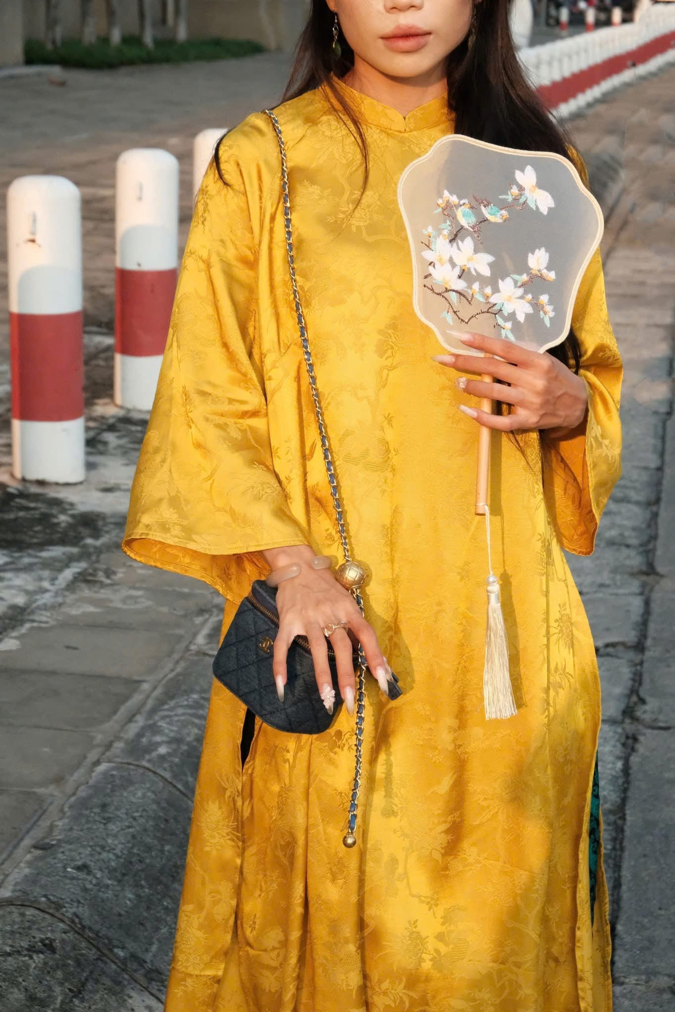 "Moc Cam Vang Premium Ao Dai set in yellow jacquard silk, traditional Vietnamese dress with peacock wormsilk pants."