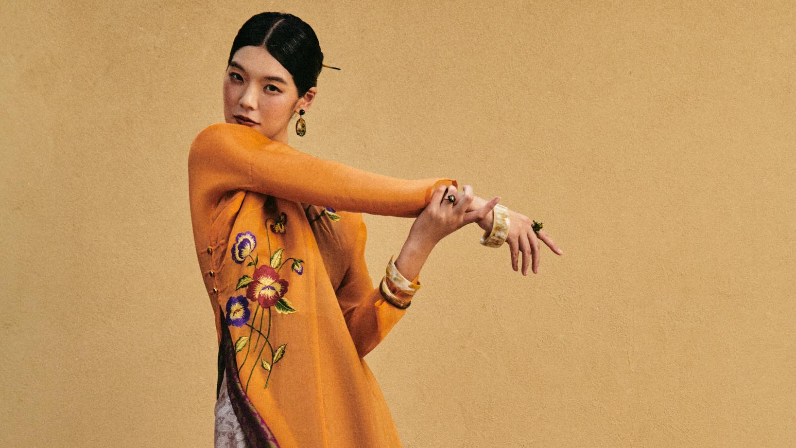 Lifestyle shot of Marigold Reverie" Luxury Ao-dai Set - Dual-layered Hand-Embroidered Organic Organza and Silk Ensemble from lo Boutique - Front view