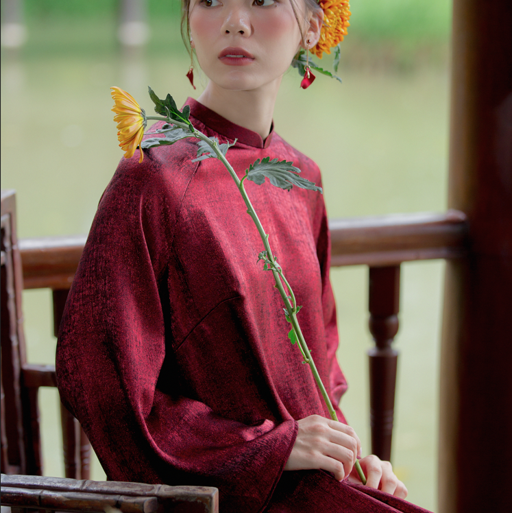 Tich Luu" Ao Dai Set in Metallic Pomegranate Red with Dark Moss Pants - Detail shot - Handcrafted design
