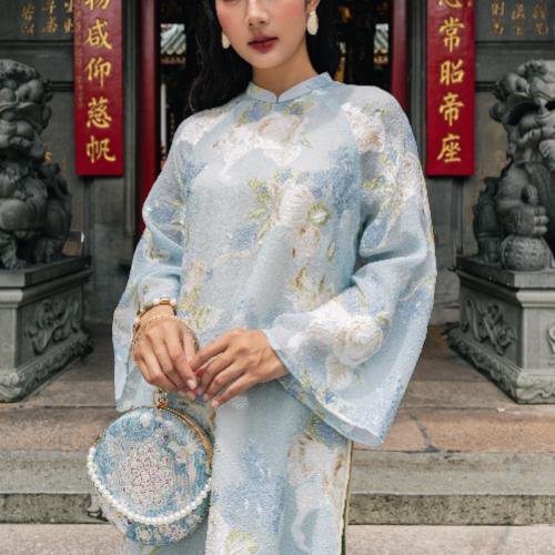 Vietnamese Ao Dai - “Nguyệt Tú” – Silk Brocade Round Clutch with Metal Handle - front view in light blue by Moc - Bags