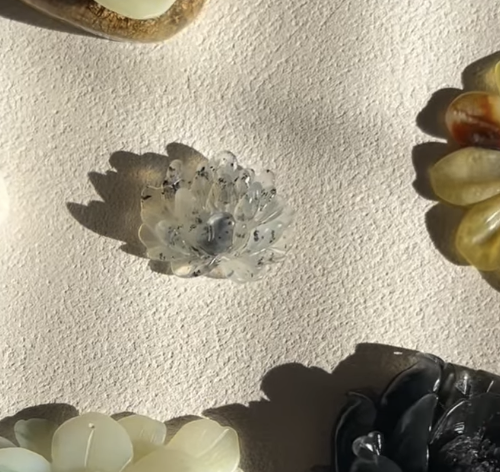 “Oliva Lotus” – Jade Necklace with Hand-Carved Lotus Pendant - flat lay display in silver by L'Orient Haus