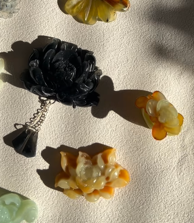 Traditional Motif - “Oliva Lotus” – Jade Necklace with Hand-Carved Lotus Pendant - flat lay display in black by L'Orient Haus