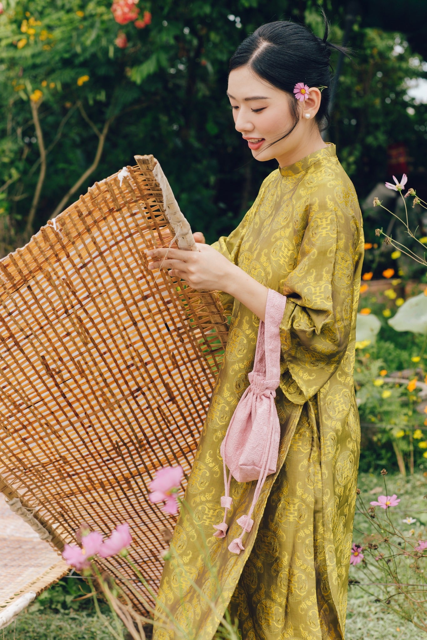 "Loc Tho Ao Dai set in light moss silk, traditional Vietnamese dress with jacquard pattern, artisan craftsmanship."
