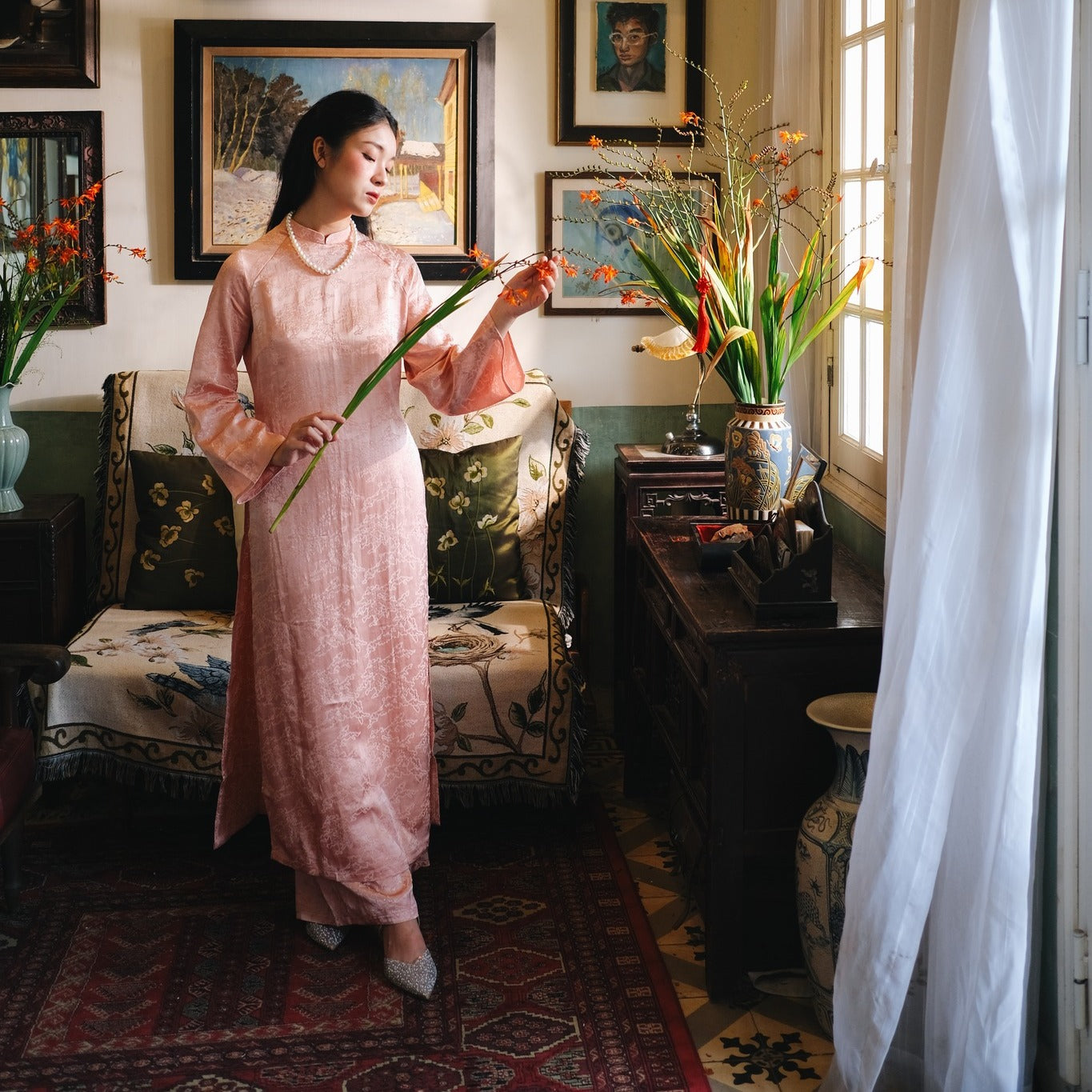 "Van Sa Ao Dai set in blush rose silk, traditional Vietnamese dress by Moc, artisan jacquard pattern."