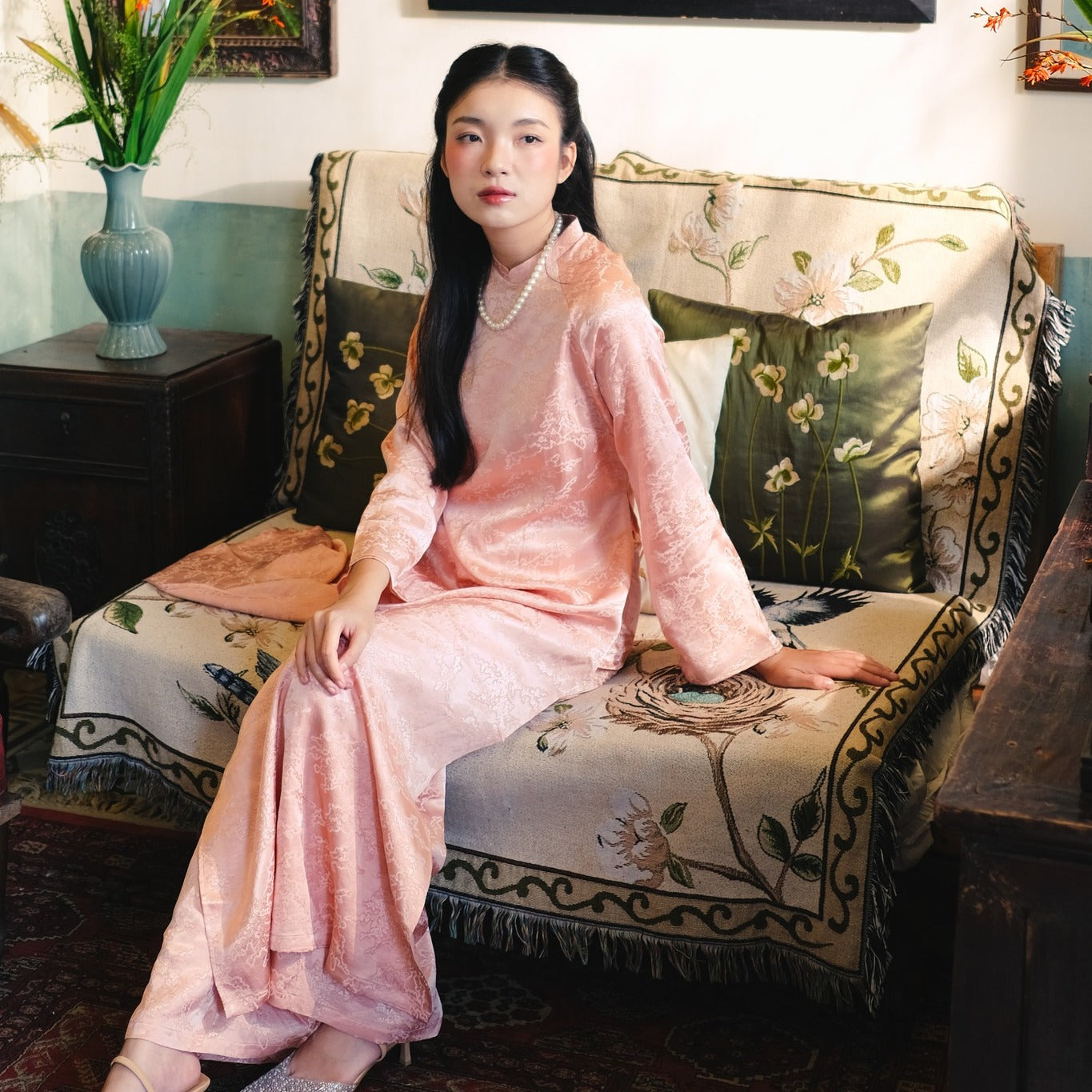 "Van Sa Ao Dai set in blush rose silk, traditional Vietnamese dress with artisan jacquard pattern."