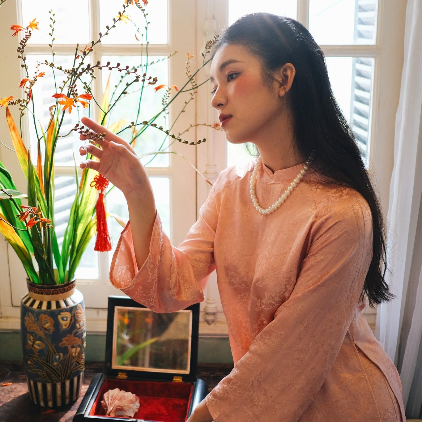 "Van Sa Ao Dai set in blush rose Hangzhou silk, traditional Vietnamese dress with jacquard pattern."