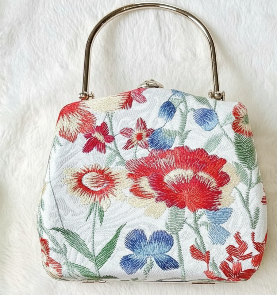 Tue Lan — Embroidered Viscose Handbag with Metal Handle in White/Pink - flat lay display by Moc - Bags