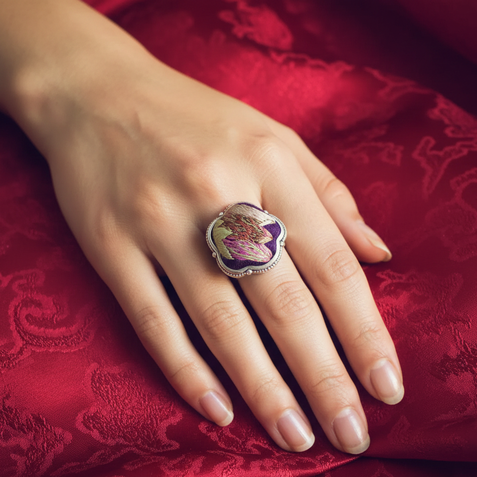 Petals Miao ring close-up showing intricate embroidered petals
